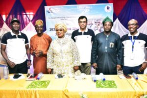 DSC 0615, Plant Director, Dangote cement Ibese, Ayyagari Subbaraidu (left) presenting items to a beneficiary; Chief (Mrs.) Olufunmilayo Adeyale; Sule Durodola; Aweni Obe, all beneficiaries and Chairman Yewa North Local Government, Hon. Olusola Akinbode (right) at the Dangote Cement Ibese Plant 2025 Edition of A-Day Out with Senior Citizens hed at Ibese plant, Ogun state.