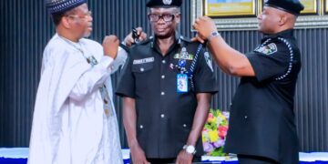 Ambassador Malami Ma’aji Assists IGP Disu in Decorating Newly Promoted CP Umar Muhammed Iya